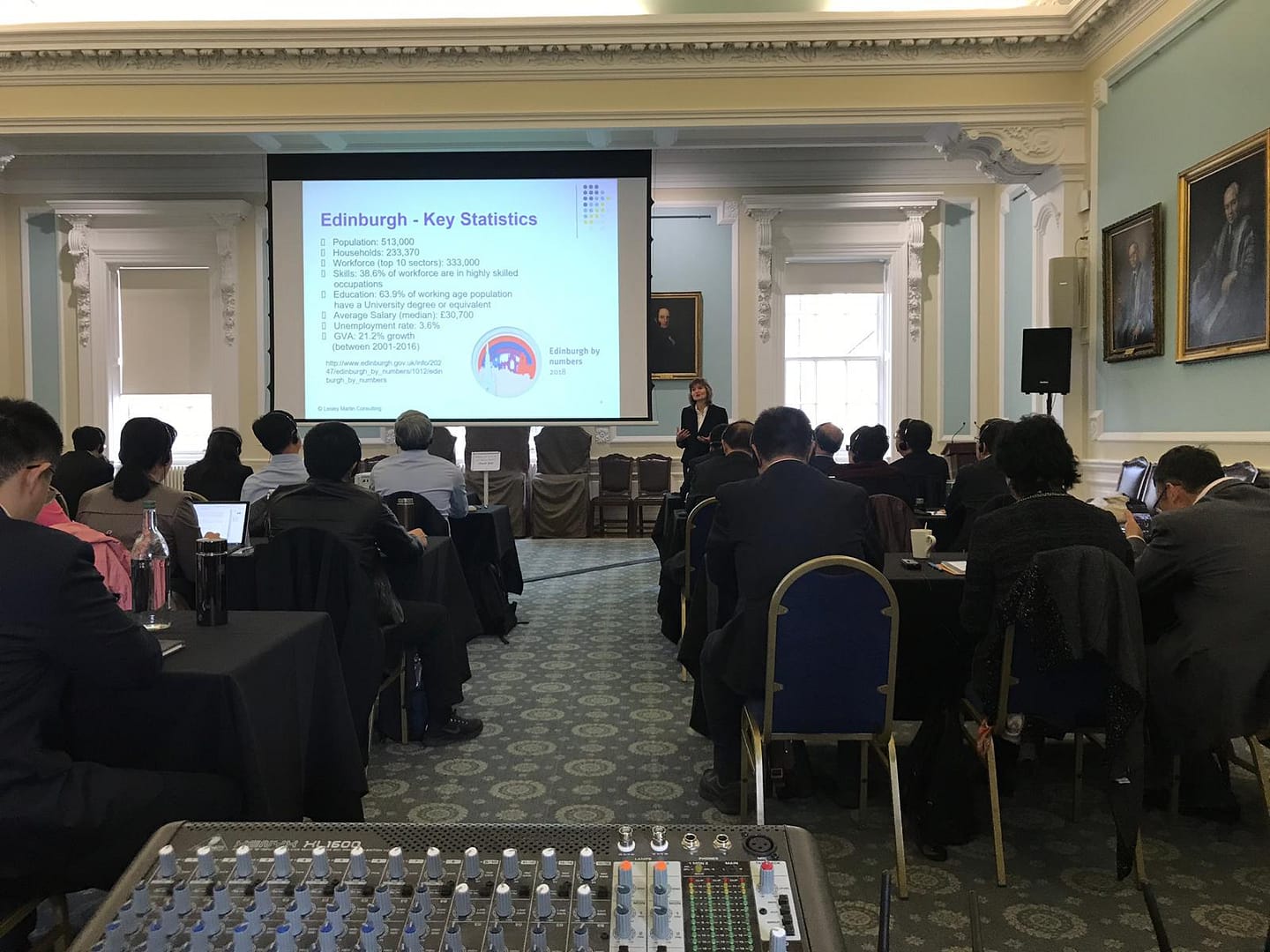 delegates in a conference listening to cost-effective simultaneous interpretation